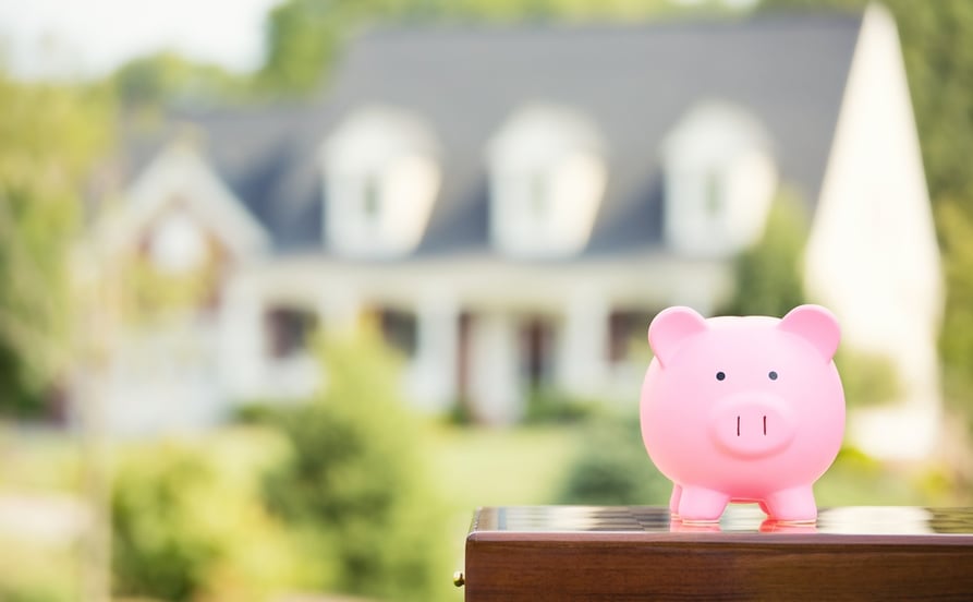 Real estate sale, home savings, loans market concept. Housing industry mortgage plan and residential tax saving strategy. Piggy bank isolated outside home on background. Focus on piggybank. Homeowner .jpeg