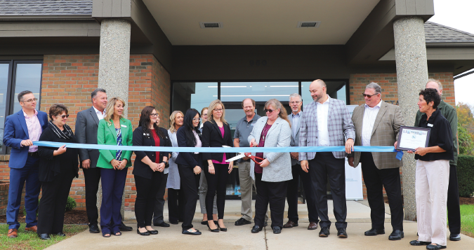 ChoiceOne employees posed in front of New Metamora office ribbon cutting